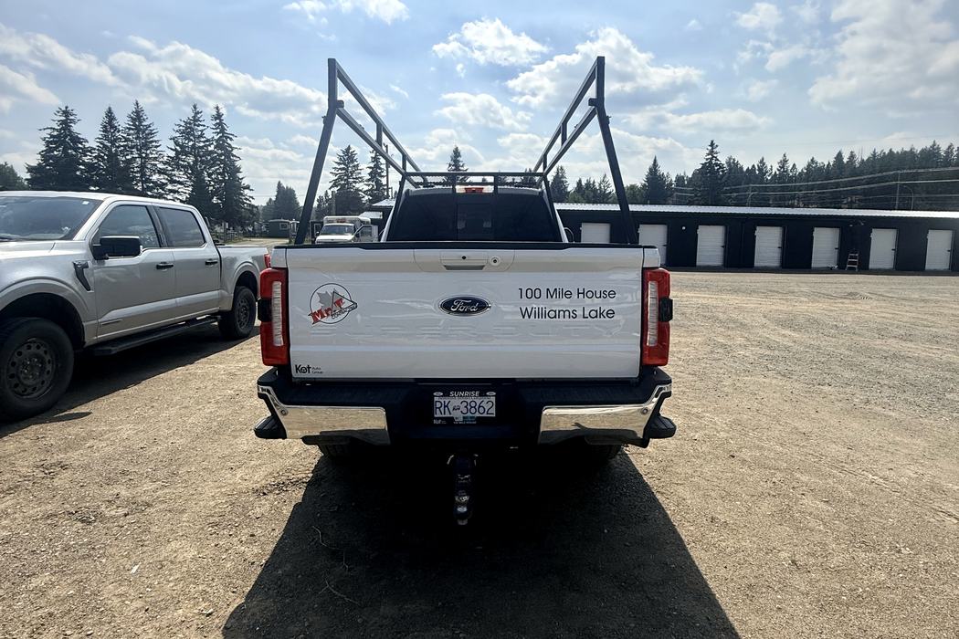 Tailgate lettering reading 100 Mile House and Williams Lake.