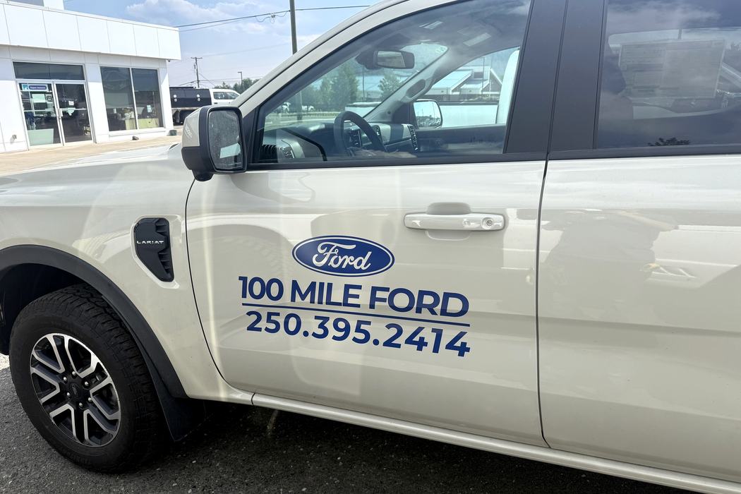 Close view of cut vinyl door decals on a Ford Ranger.