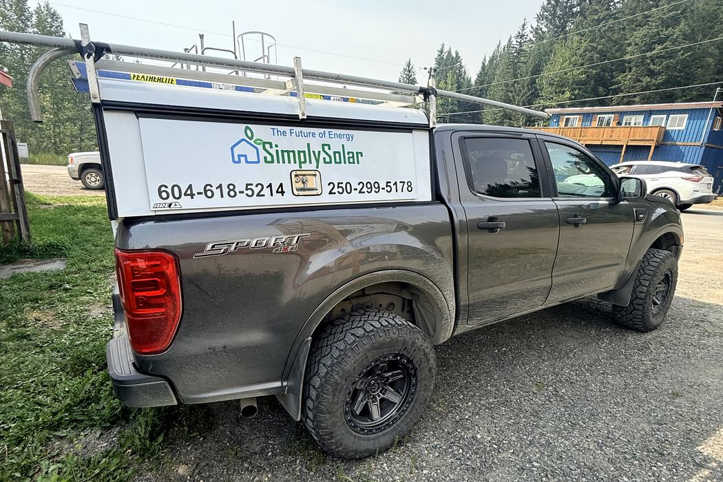 Rear view of the Simply Solar canopy panel with contact numbers.