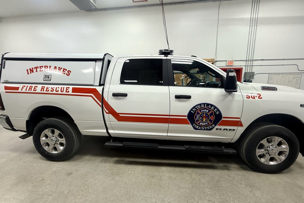 Interlakes Fire Rescue SQ-2 in side profile with red striping, department crest and unit number.