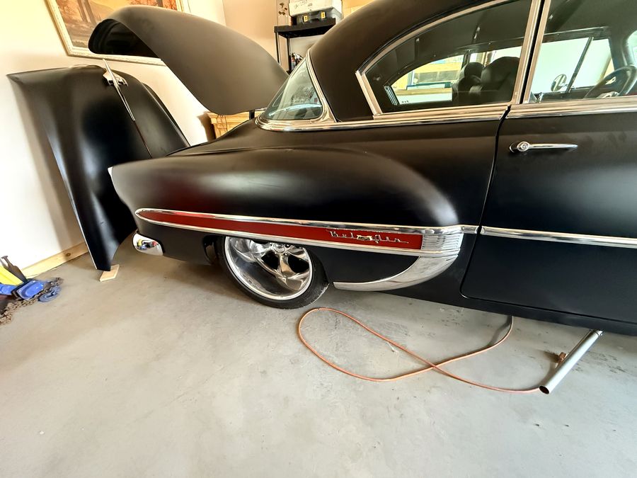 Classic car with custom vinyl work.