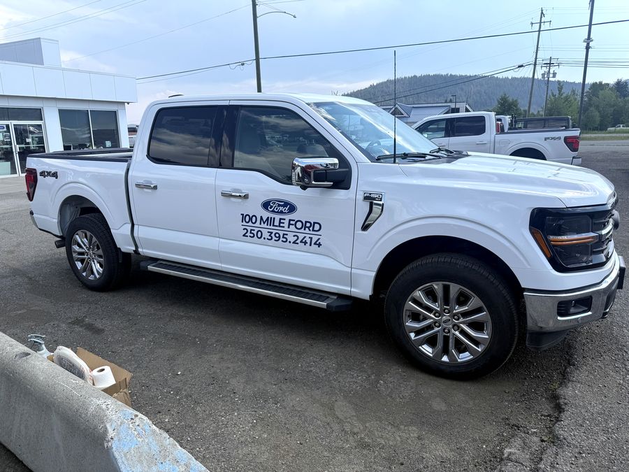 Ford F-150 with door decals.